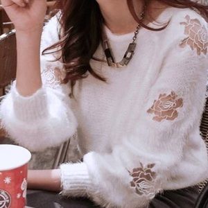 White fluffy sweater with embroidered roses